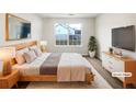 Staged bedroom with plush bedding, stylish furniture, and a relaxing ambiance at 2399 Coach Way, Jonesboro, GA 30236
