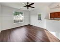 Light-filled living room with vinyl wood floors and a view of the neighborhood at 2399 Coach Way, Jonesboro, GA 30236