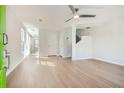 Bright and airy living room with hardwood floors and a modern ceiling fan at 480 Rockwell Sw St, Atlanta, GA 30310