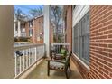Inviting porch with two chairs, showcasing a cozy outdoor seating area with views of the building's exterior at 135 E Hill St # 24, Decatur, GA 30030