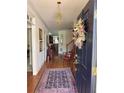 Inviting front entrance featuring hardwood floors and a decorative rug at 2392 Ivy Mountain Dr, Snellville, GA 30078