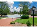 Quaint street view with manicured lawns, mature trees, and well-kept homes in a quiet neighborhood at 2392 Ivy Mountain Dr, Snellville, GA 30078