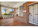 Charming front porch with brick facade and decorative ironwork at 732 Cascade Ave, Atlanta, GA 30310