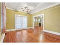 The living room features hardwood floors, a ceiling fan, and large windows that let in plenty of natural light at 732 Cascade Ave, Atlanta, GA 30310