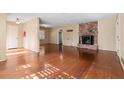 Spacious living room with hardwood floors and a brick fireplace at 508 Greenridge Cir, Stone Mountain, GA 30083