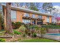 Brick apartment building with stairs and balconies overlooking the pool at 1235 Woodland Ne Ave # 1, Atlanta, GA 30324
