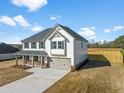 Beautiful two-story home featuring a large front porch, attached garage, and well-maintained landscaping at 1633 Fuma Leaf Way, Mcdonough, GA 30253
