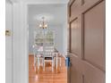 View of a dining room with hardwood floors, a chandelier, and natural light at 20 Juniper Se Ln, Cartersville, GA 30121