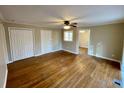 Open living space featuring hardwood floors, neutral paint, white trim and doors with backyard access at 371 Landers Sw Dr, Mableton, GA 30126