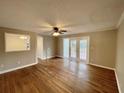 Cozy living room with hardwood floors and French doors to the backyard, bathed in natural light at 371 Landers Sw Dr, Mableton, GA 30126