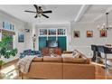Cozy living room with a large TV, stylish furniture, and easy access to the kitchen and dining area at 1258 Dekalb Ne Ave # 129, Atlanta, GA 30307