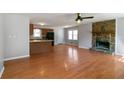 Inviting living room with beautiful hardwood floors and a stone fireplace at 37 Indian Hills Ct, Dallas, GA 30157