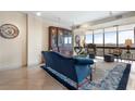 Sunlit living room showcasing floor-to-ceiling windows, a plush blue sofa, and elegant decor at 145 15Th Ne St # 843, Atlanta, GA 30309