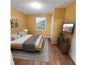 Cozy bedroom with a queen-sized bed, stylish decor, and ample natural light at 2061 Detroit Nw Ave, Atlanta, GA 30314