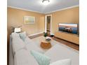 Inviting living room with a comfortable sofa, stylish rug, and modern entertainment center at 2061 Detroit Nw Ave, Atlanta, GA 30314
