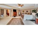 Spacious main bedroom featuring neutral walls, an ensuite bathroom and lots of closet space at 12040 Old Mountain Park Rd, Roswell, GA 30075