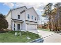 Attractive two-story home featuring a spacious driveway and well-kept yard at 7608 Parkland Bnd, Fairburn, GA 30213