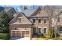Beautiful brick home with a two-car garage, trimmed lawn, and distinguished architectural design at 1837 Haven Park Se Cir, Smyrna, GA 30080