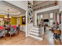 Inviting foyer showcasing hardwood floors, staircase, and entry to the dining and living rooms at 2730 Henderson Chase Ct, Tucker, GA 30084