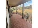 Inviting tiled front porch with decorative iron railings and plenty of space at 3702 Chesapeake Way, Atlanta, GA 30344