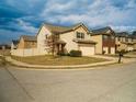 Street view of home showcasing the well-manicured lawn and attached two-car garage at 11978 Quail Rd, Hampton, GA 30228