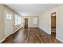 Bright living room with new wood flooring, fresh paint, and large windows at 1542 Columbia Dr, Decatur, GA 30032
