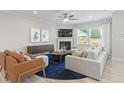 Inviting living room features a cozy fireplace, stylish furniture, and natural light at 1625 Tide Mill Rd, Cumming, GA 30040