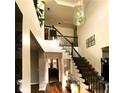 Bright, airy foyer with hardwood floors, staircase, and chandelier at 709 Eastwood Rise, Stone Mountain, GA 30087