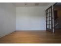 Bright room with wood flooring and a door leading to other areas of the home at 838 Roxholly Ln, Buford, GA 30518