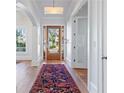 Bright and spacious foyer with hardwood floors, white trim, and a view of the front yard at 1601 Marlbrook Ne Dr, Atlanta, GA 30307