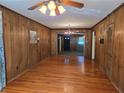 Spacious living room with hardwood floors and wooden walls at 1840 Sw King Alfred Sw Dr, Atlanta, GA 30331