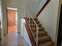 View of carpeted stairs with white railing leading to the upper level of the home at 1840 Sw King Alfred Sw Dr, Atlanta, GA 30331