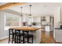 Bright kitchen featuring white cabinets, stainless steel appliances, and a butcher block island at 2597 Churchwell Ln, Tucker, GA 30084