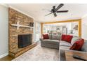 Cozy living room with a brick fireplace and a comfortable sectional sofa at 2597 Churchwell Ln, Tucker, GA 30084