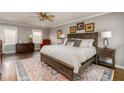 Spacious main bedroom featuring a large bed, hardwood floors, and ample natural light at 2597 Churchwell Ln, Tucker, GA 30084