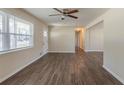 Bright living room featuring updated flooring, fresh paint, and ample natural light from a large window at 2167 Kilarney Rd, Decatur, GA 30032