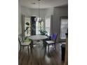 Bright breakfast nook with hardwood floors and lots of windows with natural light at 2744 Snapfinger Mnr, Stone Mountain, GA 30035