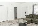 Inviting living room with a large, comfortable sofa and neutral decor at 2744 Snapfinger Mnr, Decatur, GA 30035