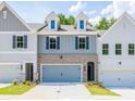 Charming townhomes with brick accents, dormer windows, and well-maintained landscaping at 4531 Moray Dr, Mableton, GA 30126