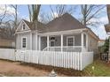 Cozy home featuring a white picket fence and a covered front porch at 789 Cooper Sw St, Atlanta, GA 30315