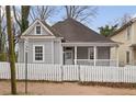 Charming home featuring a white picket fence and a welcoming front porch at 789 Cooper Sw St, Atlanta, GA 30315