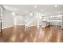 Open-concept living space with hardwood floors and a neutral color palette at 789 Cooper Sw St, Atlanta, GA 30315