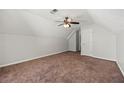Spacious bedroom featuring neutral walls, carpet floors, and a ceiling fan with light fixture at 4832 Hidden Creek Pl, Decatur, GA 30035