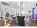 Chic living room showcasing high ceilings, large windows, hardwood floors, and modern decor with gray furniture at 260 18Th Nw St # 10202, Atlanta, GA 30363