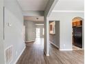 View of the Living Room with wood floors, neutral paint and an archway leading to the kitchen at 202 Nathan Sw Rd, Atlanta, GA 30331