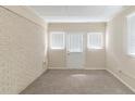 Spacious room featuring an exterior door and plenty of natural light at 2973 Cambridge Sw Dr, Atlanta, GA 30331