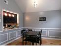 Cozy dining room with a view of the adjacent kitchen at 6051 Wintergreen Rd, Norcross, GA 30093