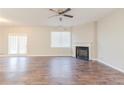 Spacious living room with wood floors, a fireplace, and access to the outdoors at 811 Lake Chase, Fairburn, GA 30213