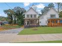 Charming two-story home with a landscaped yard and a paved driveway at 826 Gaston Street Sw, Atlanta, GA 30310
