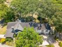 Spacious property with mature trees, lush landscaping, and long driveway leading to the house at 1000 Nw Main St, Conyers, GA 30012
